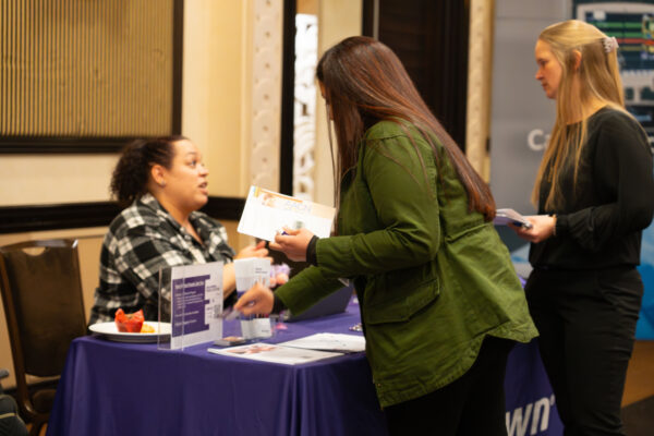 Nurses visiting a vendor table